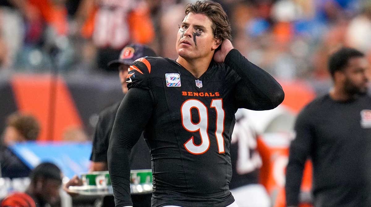 Cincinnati Bengals defensive end Trey Hendrickson (91) watches a replay as the Detroit Lions celebrate a touchdown in the fourth quarter of the NFL Week 5 game between the Cincinnati Bengals and the Detroit Lions at Paycor Stadium in downtown Cincinnati on Sunday, Oct. 5, 2025. The Bengals continued a losing streak, falling 37-24 to the Lions.