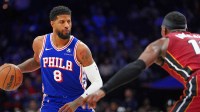 Philadelphia 76ers forward Paul George (8) controls the ball against the Miami Heat in the fourth quarter at Wells Fargo Center.