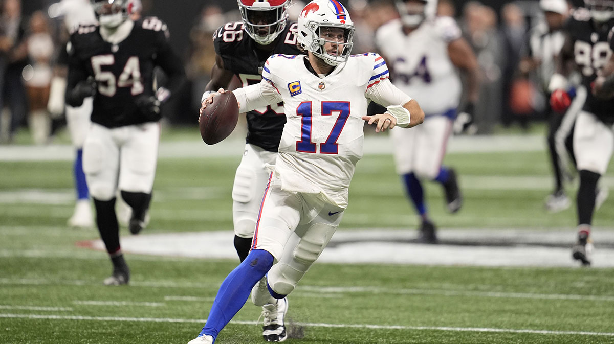 Buffalo Bills quarterback Josh Allen (17) carries the ball against the Atlanta Falcons during the second half of a game at Mercedes-Benz Stadium.