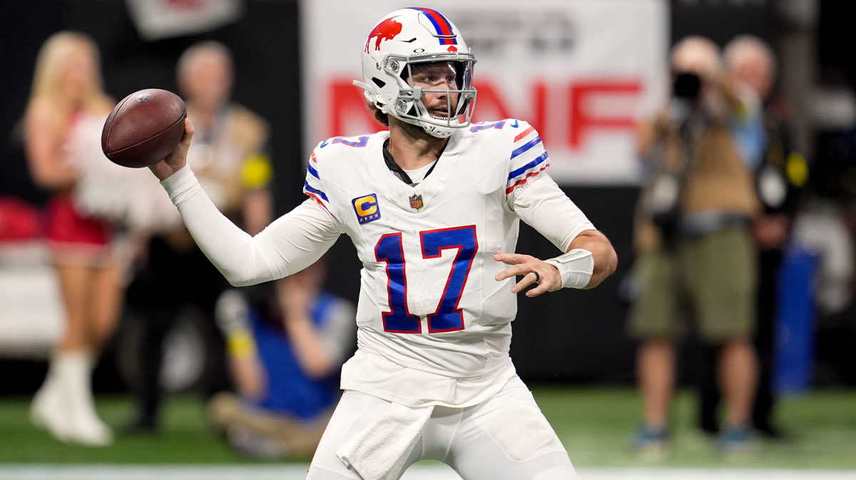 Buffalo Bills quarterback Josh Allen (17) throws downfield against the Atlanta Falcons during the first half of a game at Mercedes-Benz Stadium.