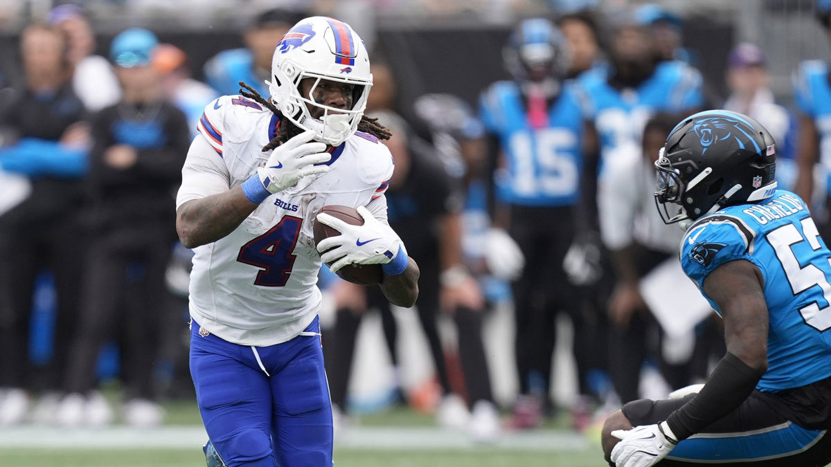 Buffalo Bills running back James Cook III (4) scores a touchdown against Carolina Panthers linebacker Claudin Cherelus (53) during the second half at Bank of America Stadium.