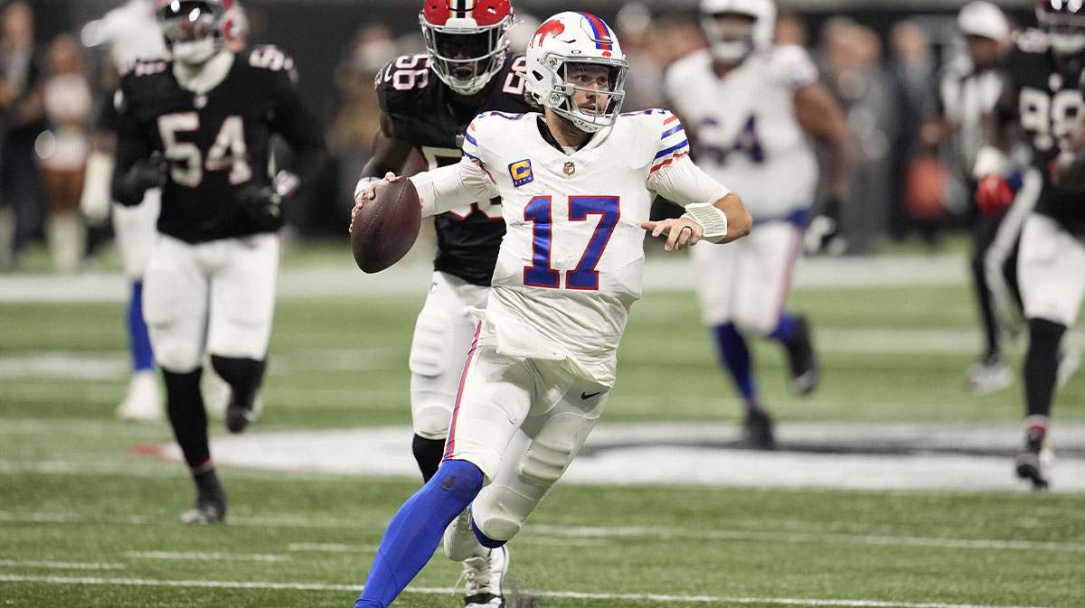 Buffalo Bills quarterback Josh Allen (17) carries the ball against the Atlanta Falcons during the second half of a game at Mercedes-Benz Stadium.