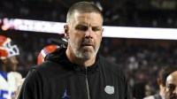Florida Gators head coach Billy Napier walks off the field after the game against the Texas A&M Aggies at Kyle Field.