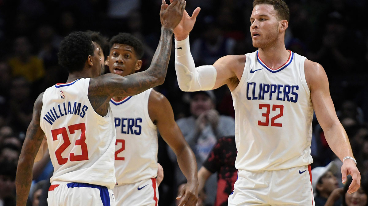 LA Clippers forward Blake Griffin (32) high-fives guard Lou Williams (23) after scoring in the third quarter basket against the Houston Rockets at Staples Center. The Clippers went on to a 113-102 win.