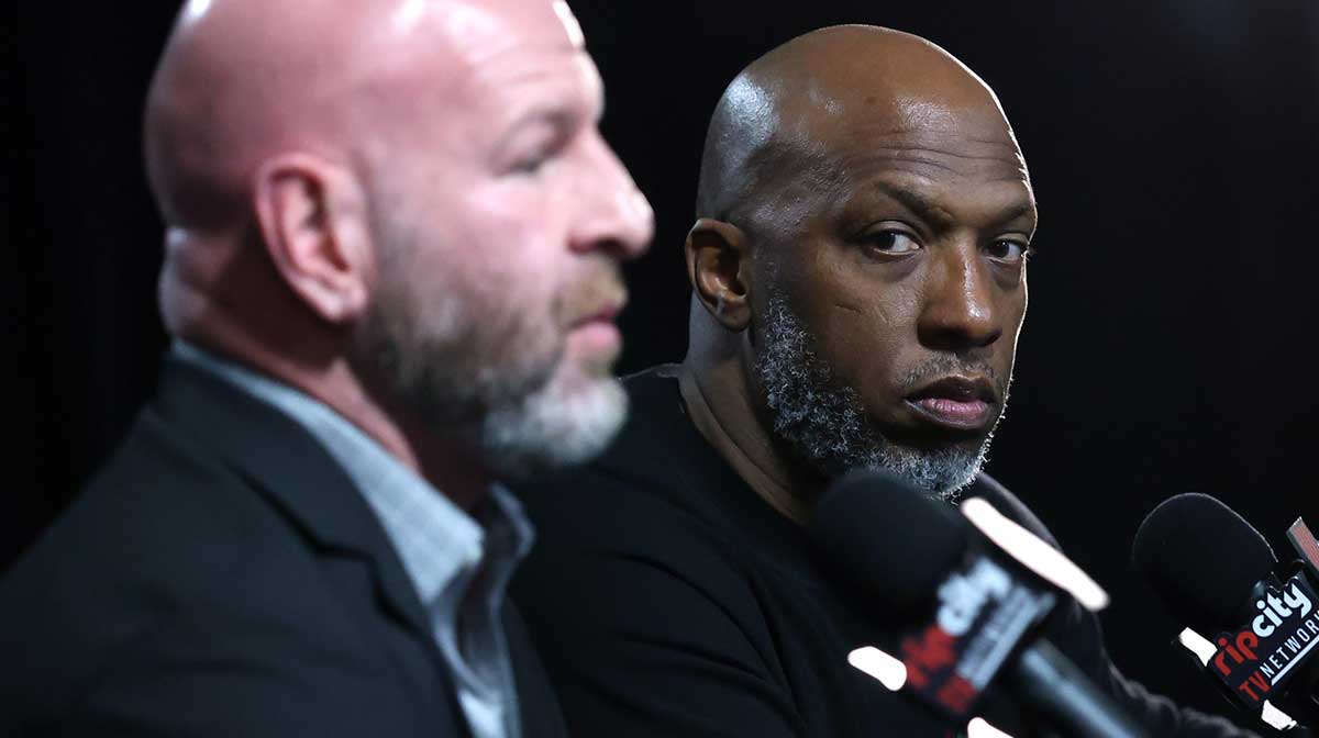 Portland Trail Blazers head coach Chauncey Billups (right) listens to Trail Blazersí general manager Joe Cronin answer a question during a press conference before Portland plays their last season game against Los Angeles Lakers at Moda Center.