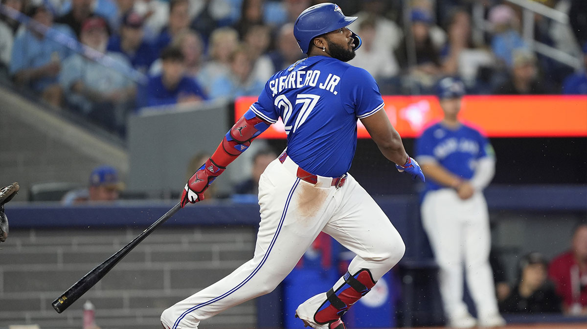 Toronto Blue Jays first baseman Vladimir Guerrero Jr. (27) hits a single against the Boston Red Sox during the third inning at Rogers Centre.