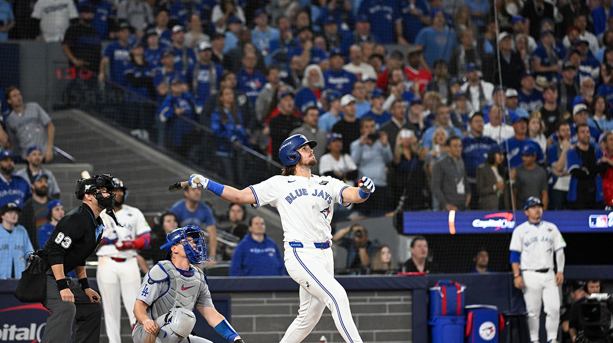 Toronto Blue Jays right fielder Addison Barger (47) hits a grand slam against the Los Angeles Dodgers in the sixth inning during game one of the 2025 MLB World Series at Rogers Centre.