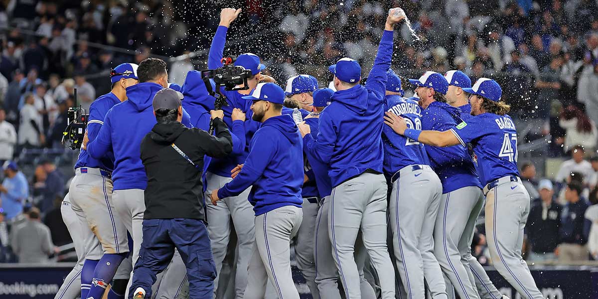 The Toronto Blue Jays celebrate after beating the New York Yankees to win the ALDS round for the 2025 MLB playoffs at Yankee Stadium. Mandatory Credit: Brad Penner-Imagn Images