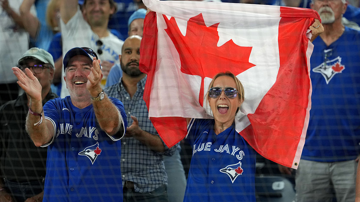 Toronto Blue Jays fans celebrate after winning game two of the ALDS against the New York Yankees for the 2025 MLB playoffs at Rogers Centre.