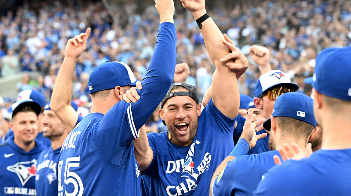 Blue Jays designated hitter George Springer (4) celebrates