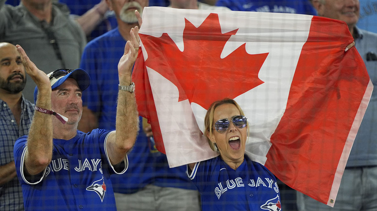 Toronto Blue Jays fans celebrate after winning game two of the ALDS against the New York Yankees for the 2025 MLB playoffs at Rogers Centre.