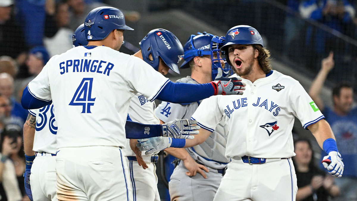 Toronto Blue Jays right fielder Addison Barger (47) celebrates with teammates after hitting a grand slam against the Los Angeles Dodgers in the sixth inning during game one of the 2025 MLB World Series at Rogers Centre.