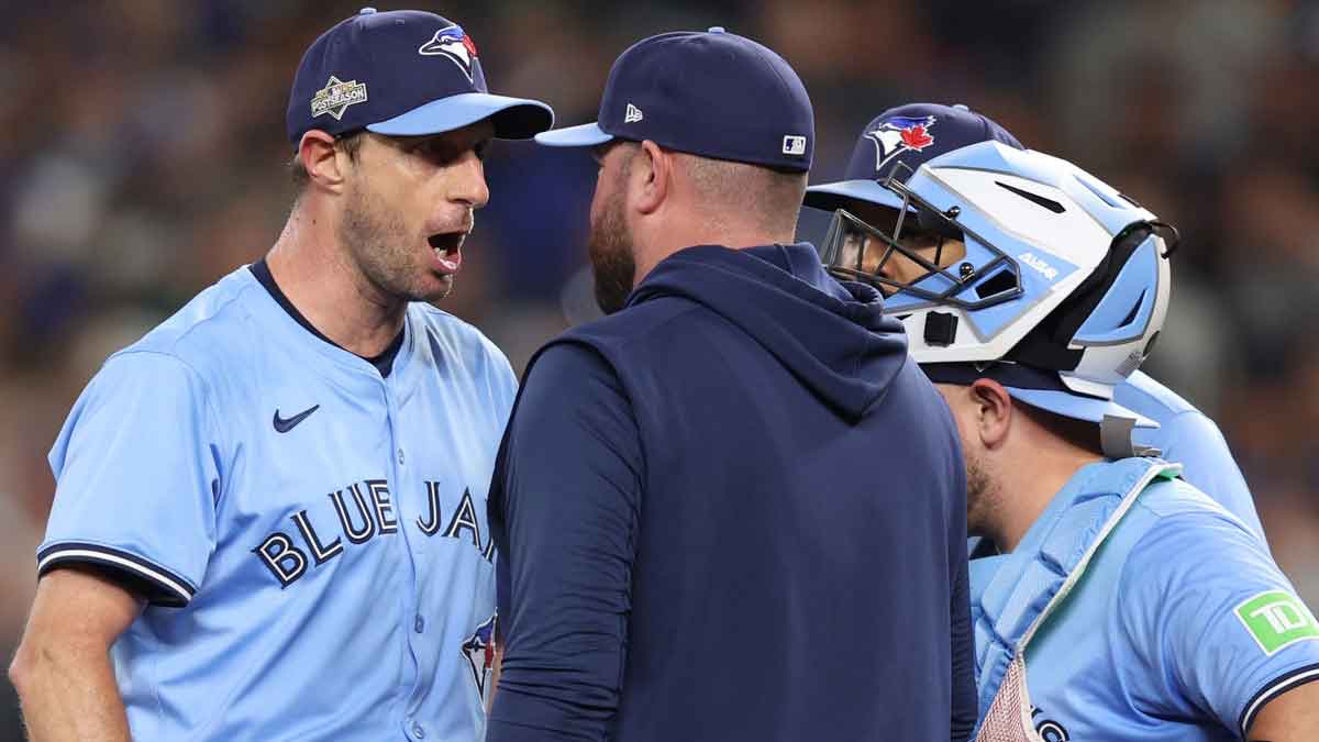 Toronto Blue Jays pitcher Max Scherzer (31) talks to manager John Schneider (14) in the fifth inning against the Seattle Mariners during game four of the ALCS round for the 2025 MLB playoffs at T-Mobile Park.