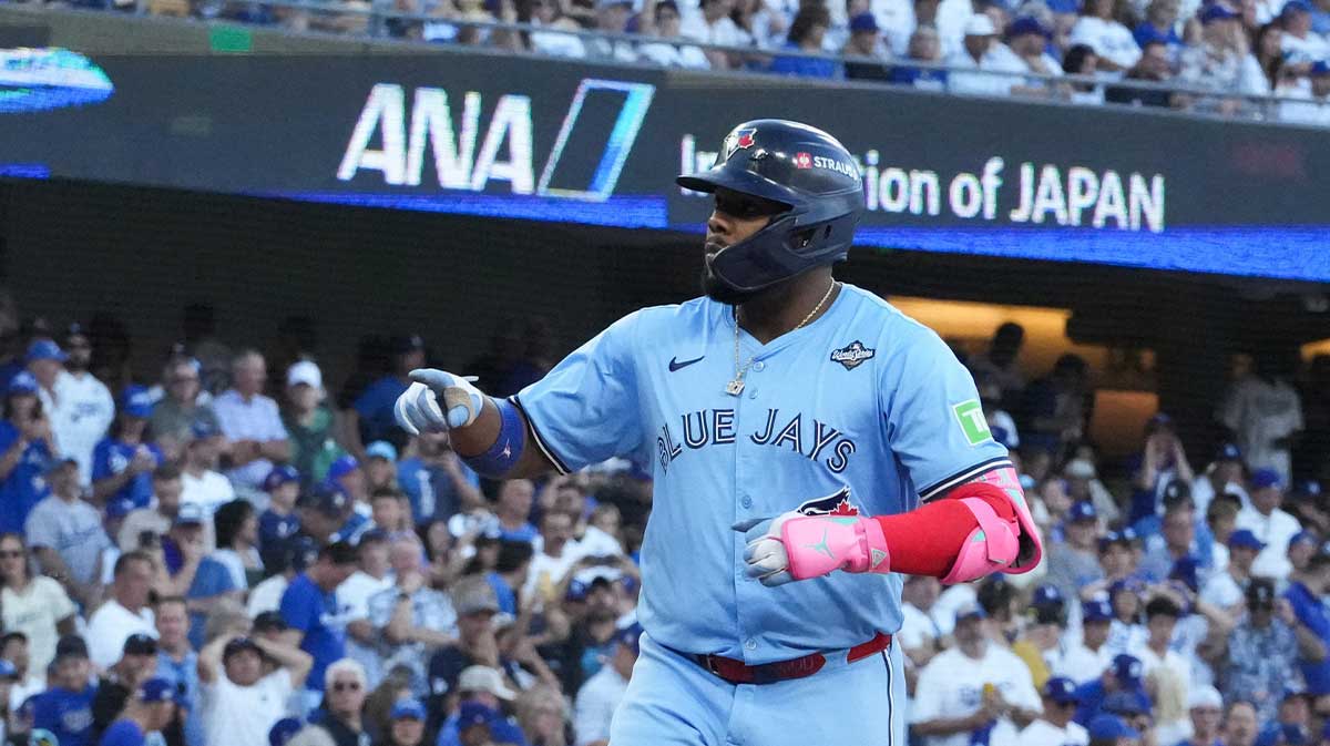 Toronto Blue Jays first baseman Vladimir Guerrero Jr. (27) celebrates after hitting a solo home run during the first inning against the Los Angeles Dodgers during game five of the 2025 MLB World Series at Dodger Stadium.