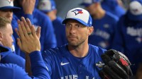 Toronto Blue Jays pitcher Max Scherzer (31) reacts in the dugout after being relieved in the fifth inning against the Los Angeles Dodgers during game three of the 2025 MLB World Series at Dodger Stadium.