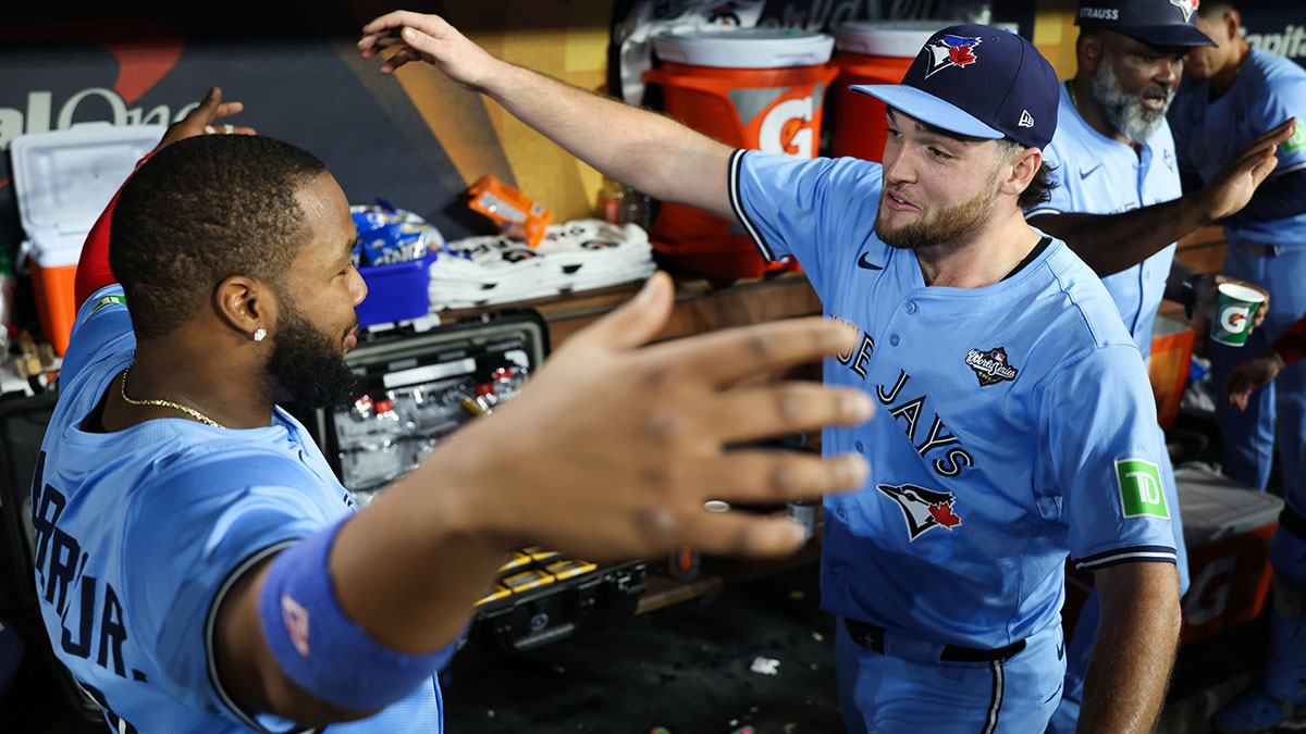 Toronto Blue Jays pitcher Trey Yesavage (39) celebrates with Toronto Blue Jays first baseman Vladimir Guerrero Jr. (27) after the game against the Los Angeles Dodgers during game five of the 2025 MLB World Series at Dodger Stadium.