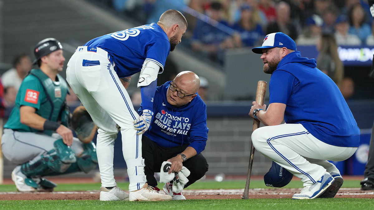 Blue Jays right fielder Nathan Lukes (38) is checked out