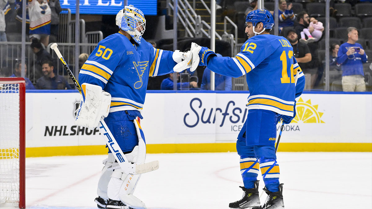 St. Louis Blues goaltender Jordan Binnington (50) celebrates with left wing Milan Lucic (12) after the Blues defeated the Ottawa Senators at Enterprise Center.