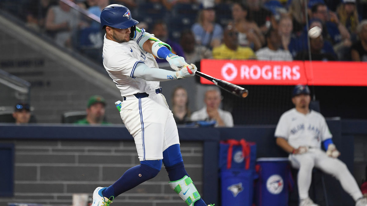 Toronto Blue Jays shortstop Bo Bichette (11) hits a solo home run against the Los Angeles Angels in the fourth inning at Rogers Centre.