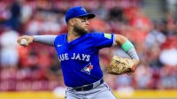 Toronto Blue Jays shortstop Bo Bichette (11) throws to first to get Cincinnati Reds third baseman Ke'Bryan Hayes (not pictured) out in the second inning at Great American Ball Park.