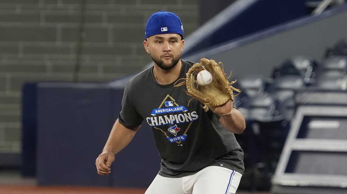 Toronto Blue Jays shortstop Bo Bichette (11) catches a ball during batting pratice on media day before game one of the World Series at Rogers Centre.