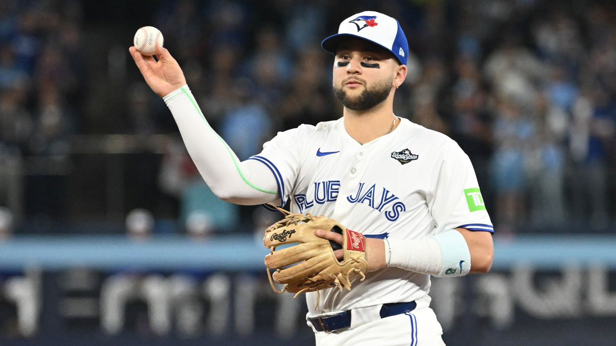 Toronto Blue Jays second baseman Bo Bichette (11) makes a play to get out Los Angeles Dodgers first baseman Freddie Freeman (not pictured) in the first inning during game one of the 2025 MLB World Series at Rogers Centre.
