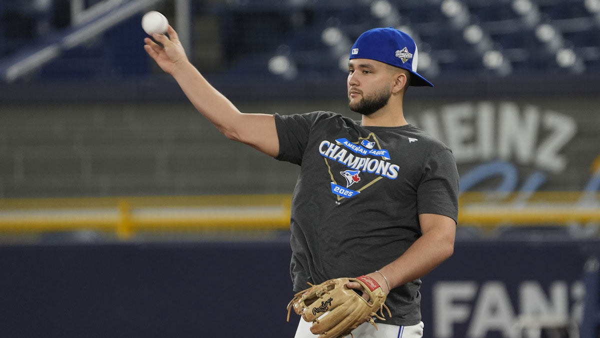 Toronto Blue Jays shortstop Bo Bichette (11) throws a ball during batting pratice on media day before game one of the World Series at Rogers Centre.