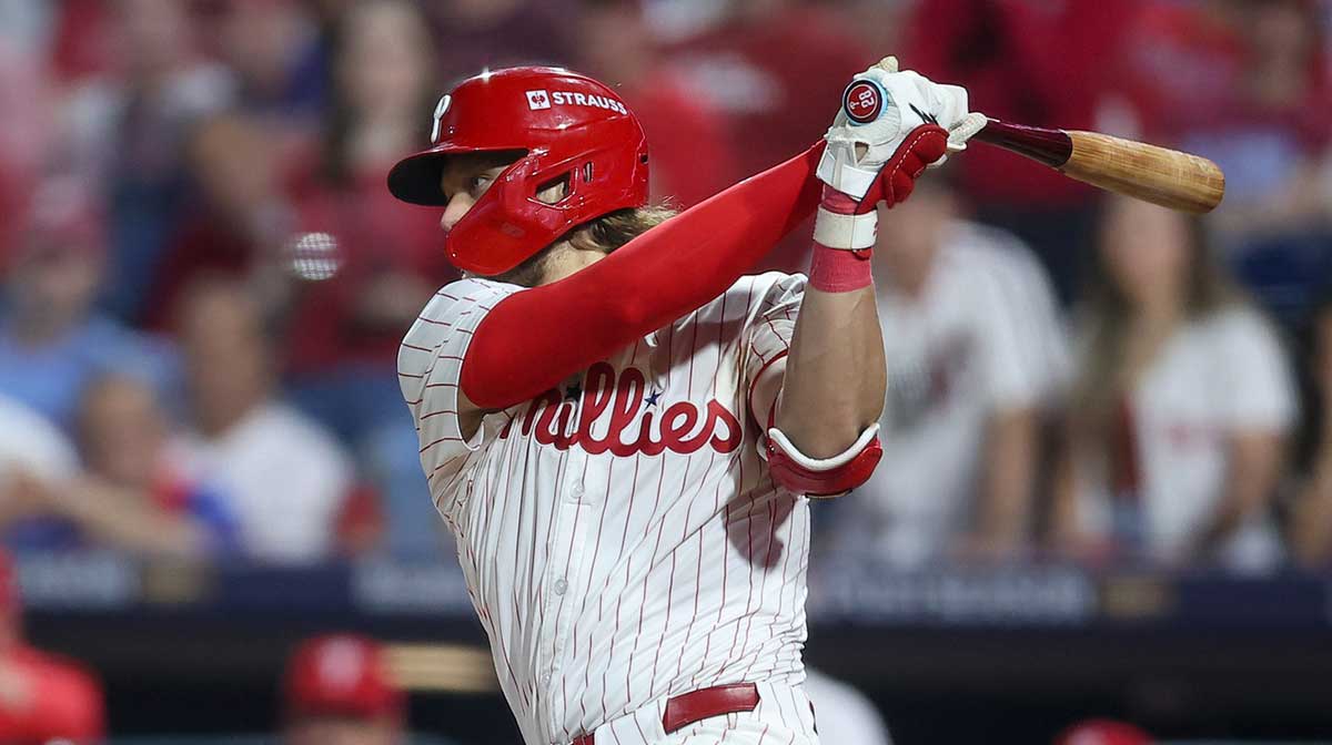 Philadelphia Phillies third baseman Alec Bohm (28) hits a single against the Los Angeles Dodgers in the ninth inning during game two of the NLDS round for the 2025 MLB playoffs at Citizens Bank Park..