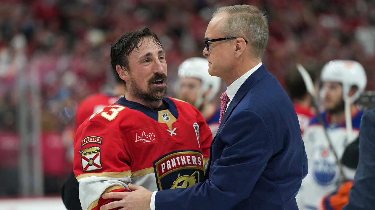 Florida Panthers center Brad Marchand (63) speaks to head coach Paul Maurice after winning game six of the 2025 Stanley Cup Final against the Edmonton Oilers at Amerant Bank Arena. 