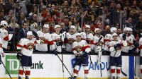 Florida Panthers left wing Brad Marchand (63), left, reacts to the applause from Boston fans after a tribute to him played during a timeout in the first period against the Boston Bruins at TD Garden.