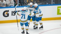 St. Louis Blues forward Mathieu Joseph (71) and forward Pius Suter (22) and forward Jimmy Snuggerud (21) celebrate Snuggerud’s goal against the Vancouver Canucks in the first period at Rogers Arena.