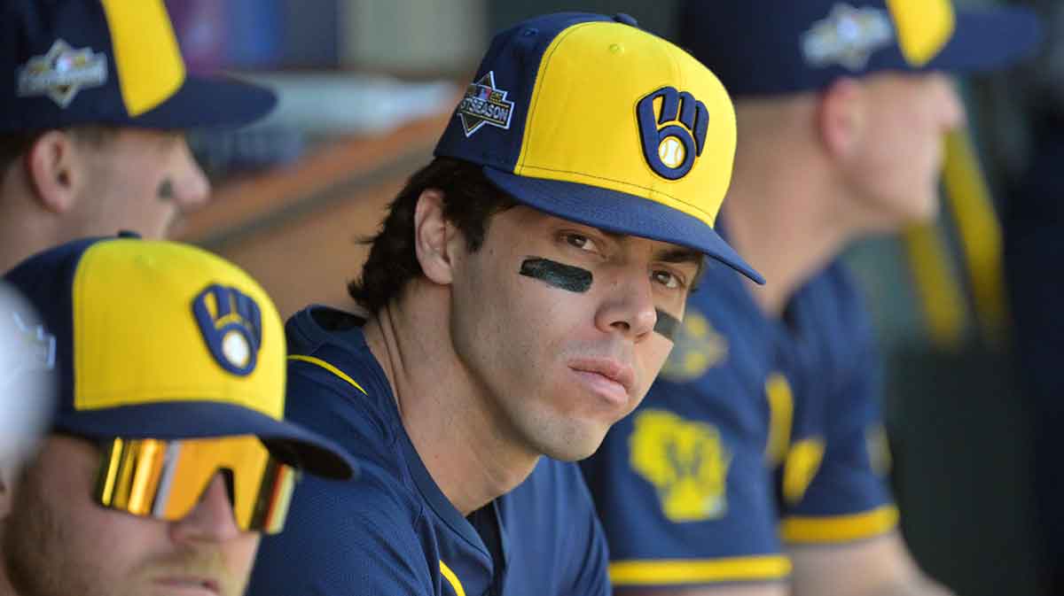 Milwaukee Brewers left fielder Christian Yelich (22) looks on from the dugout before game three against the Los Angeles Dodgers in the NLCS round for the 2025 MLB playoffs at Dodger Stadium.