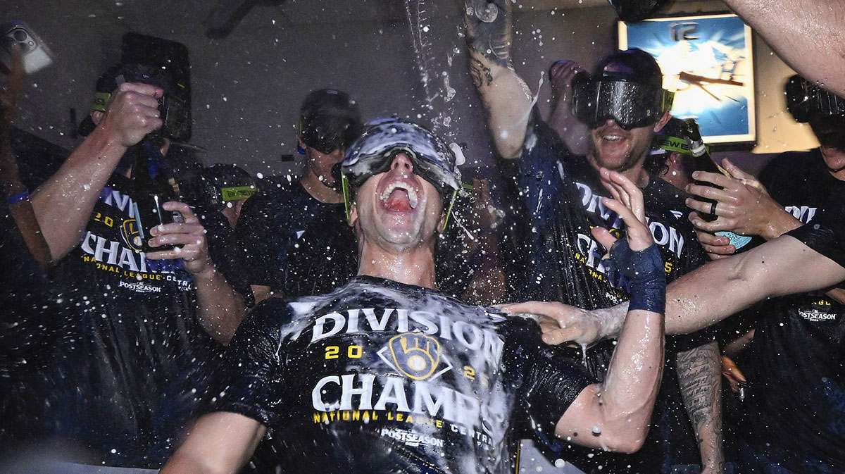 Brewers right fielder Sal Frelick (10) is showered with champagne