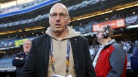 New York Yankees general manager Brian Cashman walks on the field before game three of the 2024 MLB World Series between the New York Yankees and the Los Angeles Dodgers at Yankee Stadium.