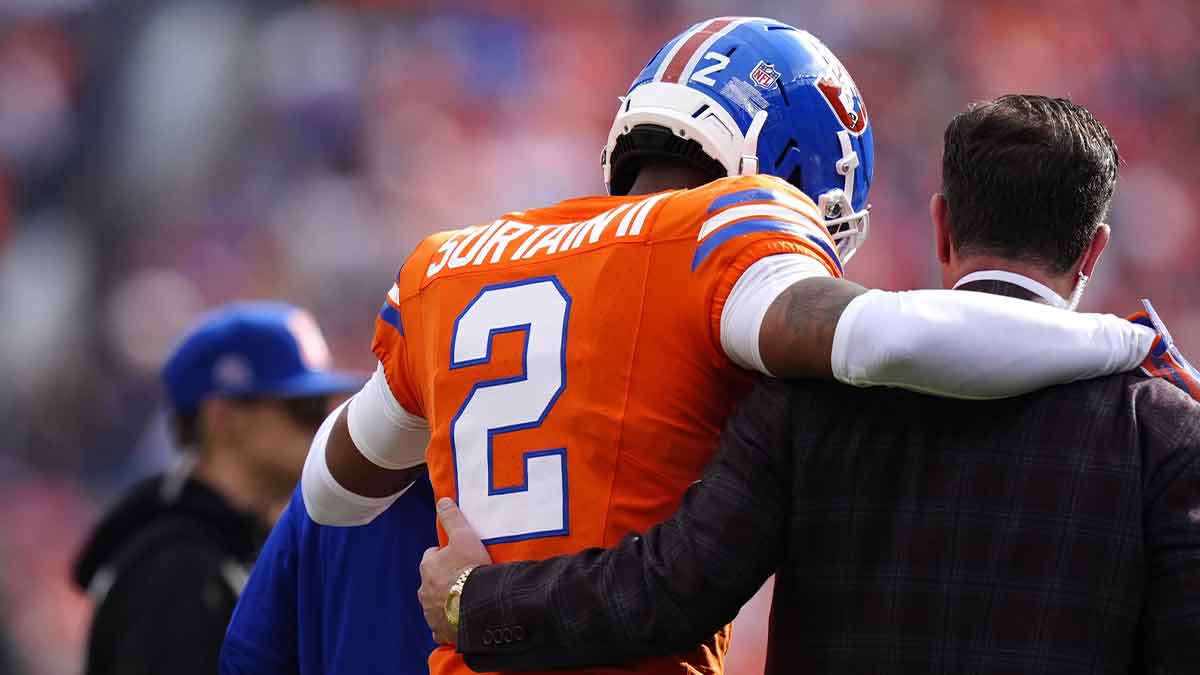 Denver Broncos cornerback Pat Surtain II (2) leaves the field after an injury in the first quarter against the Denver Broncos at Empower Field at Mile High.