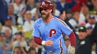 Philadelphia Phillies first baseman Bryce Harper (3) reacts as he scores a run during the fourth inning in game three of the NLDS against the Los Angeles Dodgers during the 2025 MLB playoffs at Dodger Stadium.