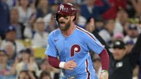 Philadelphia Phillies first baseman Bryce Harper (3) reacts as he scores a run during the fourth inning in game three of the NLDS against the Los Angeles Dodgers during the 2025 MLB playoffs at Dodger Stadium.