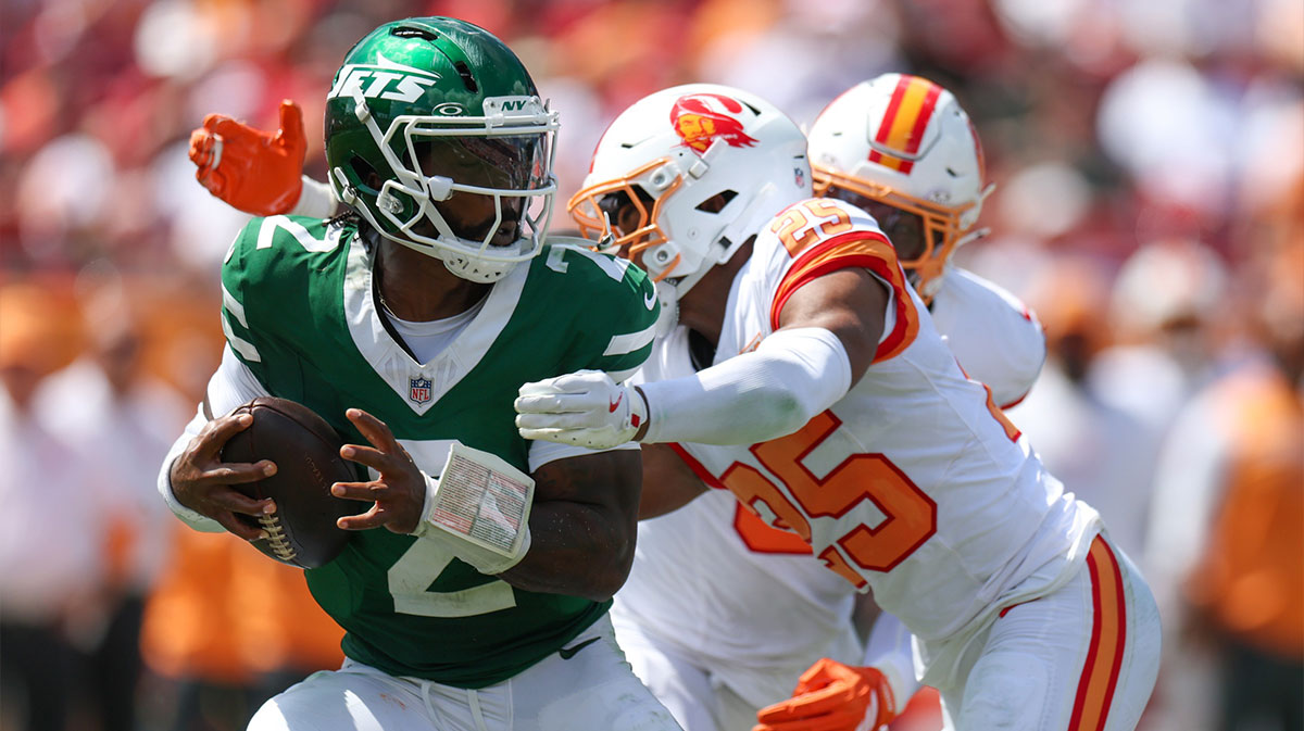 New York Jets quarterback Tyrod Taylor (2) is pressured by Tampa Bay Buccaneers cornerback Jacob Parrish (25) in the second quarter at Raymond James Stadium.