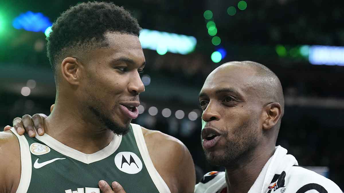 Milwaukee Bucks forward Giannis Antetokounmpo (34) and Washington Wizards forward Khris Middleton (22) former teammates talk to each other after their game at Fiserv Forum.