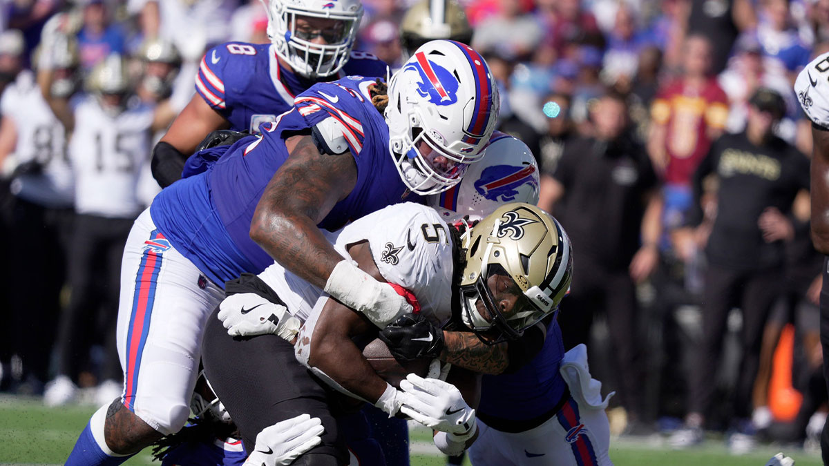 Buffalo Bills Jordan Phillips, Dorian Williams and another teammate wrap up New Orleans Saints running back Kendre Miller and stop his run during second half action of the Bills home game against the New Orleans Saints in Orchard Park on Sept. 28, 2025.