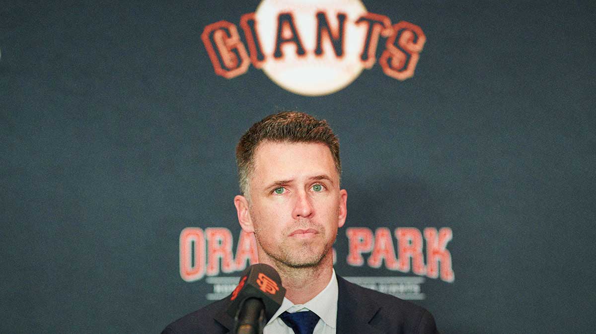 San Francisco Giants president of baseball operations Buster Posey listens during the introductory press conference for shortstop Willy Adames (not pictured) at Oracle Park.