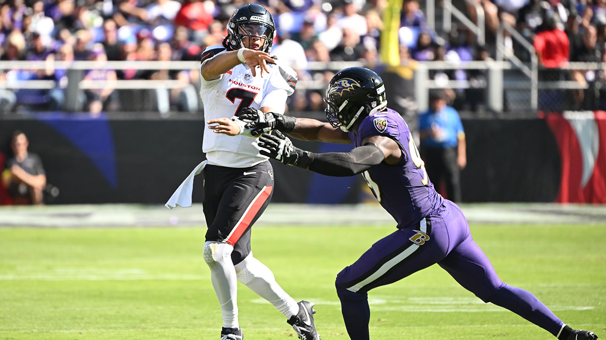 Houston Texans quarterback C.J. Stroud (7) throws past Baltimore Ravens linebacker Odafe Oweh (99) during the second quarter at M&T Bank Stadium.