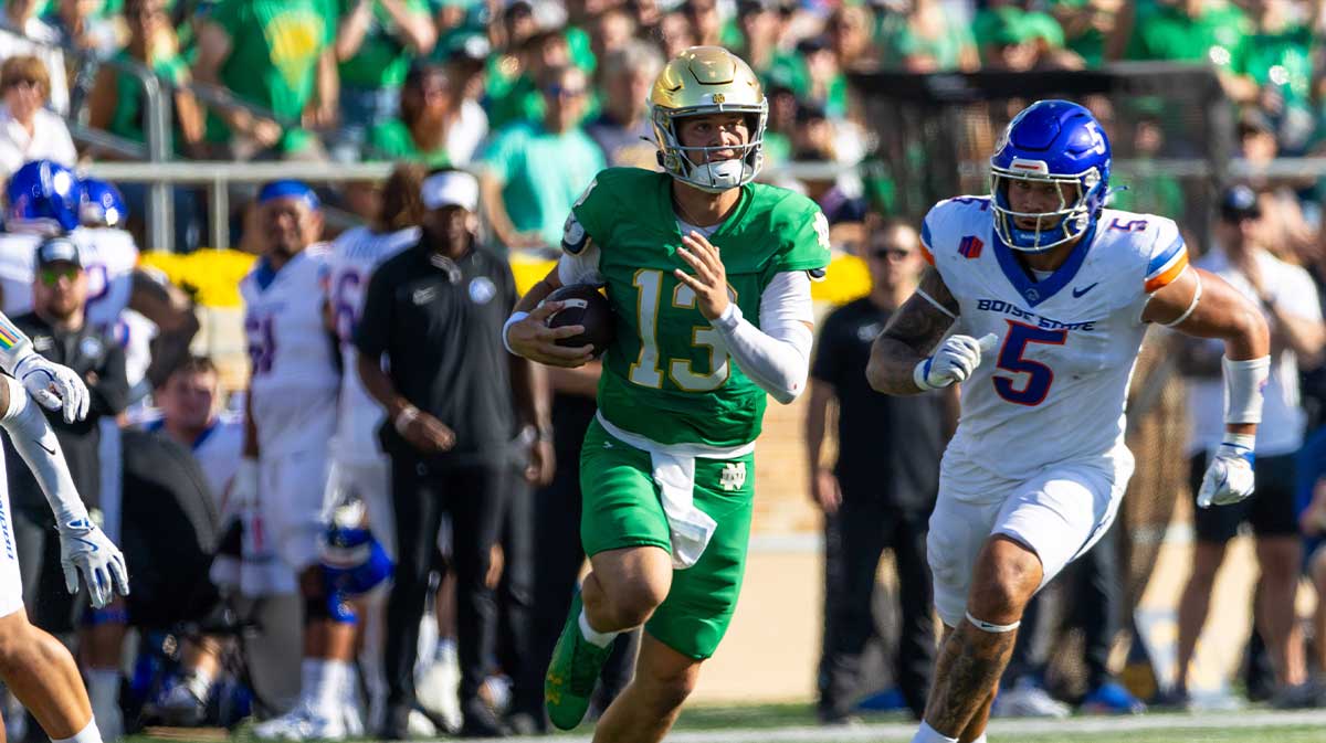 Notre Dame Fighting Irish quarterback CJ Carr (13) runs the ball against the Boise State Broncos during the first half at Notre Dame Stadium.