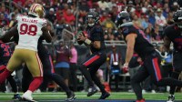 Houston Texans quarterback C.J. Stroud (7) looks to throw downfield during the first quarter against the San Francisco 49ers at NRG Stadium.