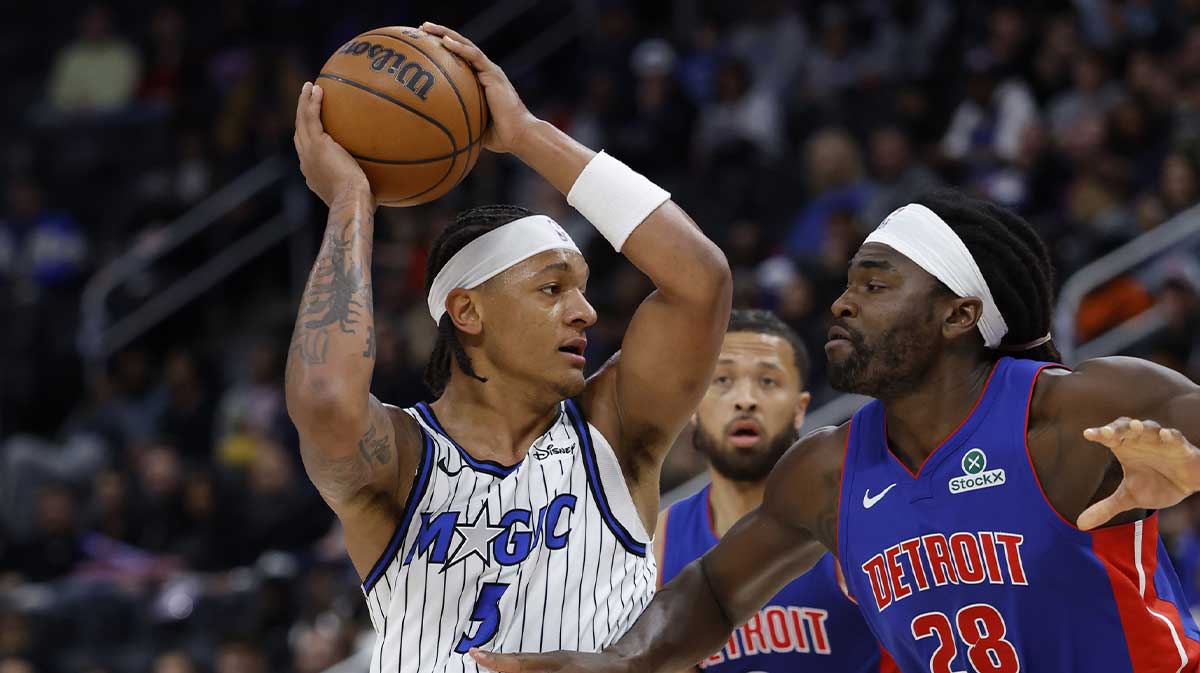 Orlando Magic forward Paolo Banchero (5) is defended by Detroit Pistons forward Isaiah Stewart (28) in the first half at Little Caesars Arena.