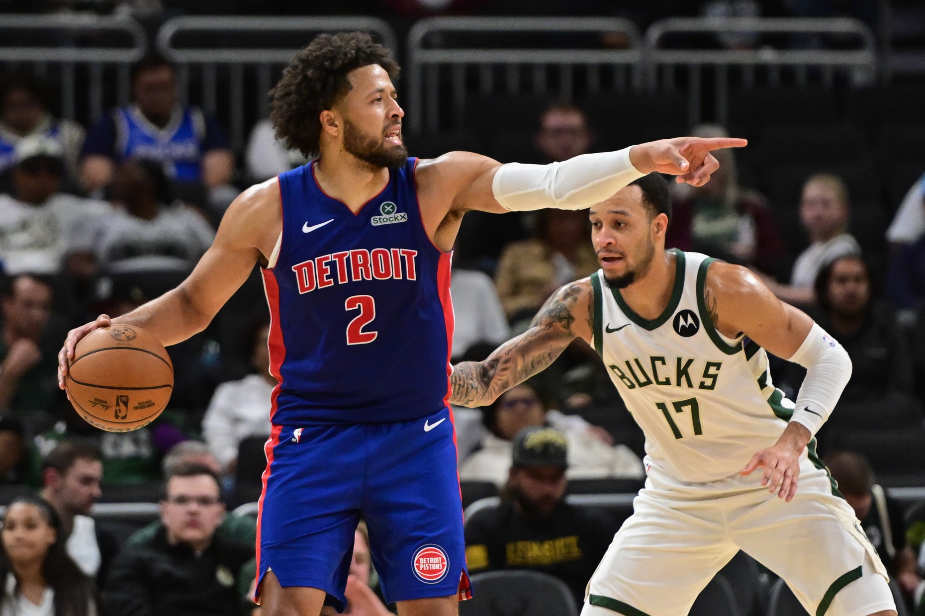 Detroit Pistons guard Cade Cunningham (2) gestures to teammate against Milwaukee Bucks forward Amir Coffey (17) in the second quarter at Fiserv Forum.