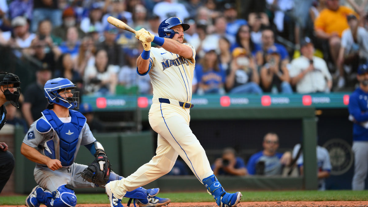 Seattle Mariners designated hitter Cal Raleigh (29) hits a single against the Los Angeles Dodgers during the eighth inning at T-Mobile Park.