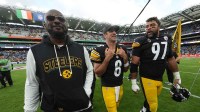 Pittsburgh Steelers coach Mike Tomlin (left), quarterback Aaron Rodgers (center) and defensive tackle Cameron Heyward (97) leave the field after an NFL International Series game against the Minnesota Vikings at Croke Park.