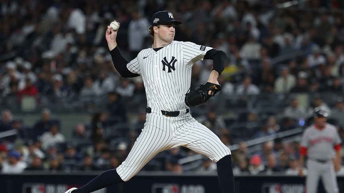 New York Yankees starting pitcher Cam Schlittler (31) throws to the plate in the third inning against the Boston Red Sox during game three of the Wildcard round for the 2025 MLB playoffs at Yankee Stadium. 
