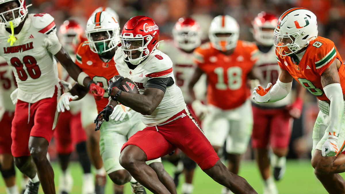 Louisville Cardinals wide receiver Chris Bell (0) carries the football for a touchdown against the Miami Hurricanes during the fourth quarter at Hard Rock Stadium.